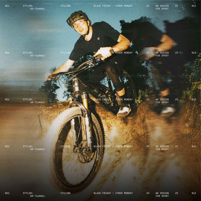 mtb rider going downhill with stylized text in the background