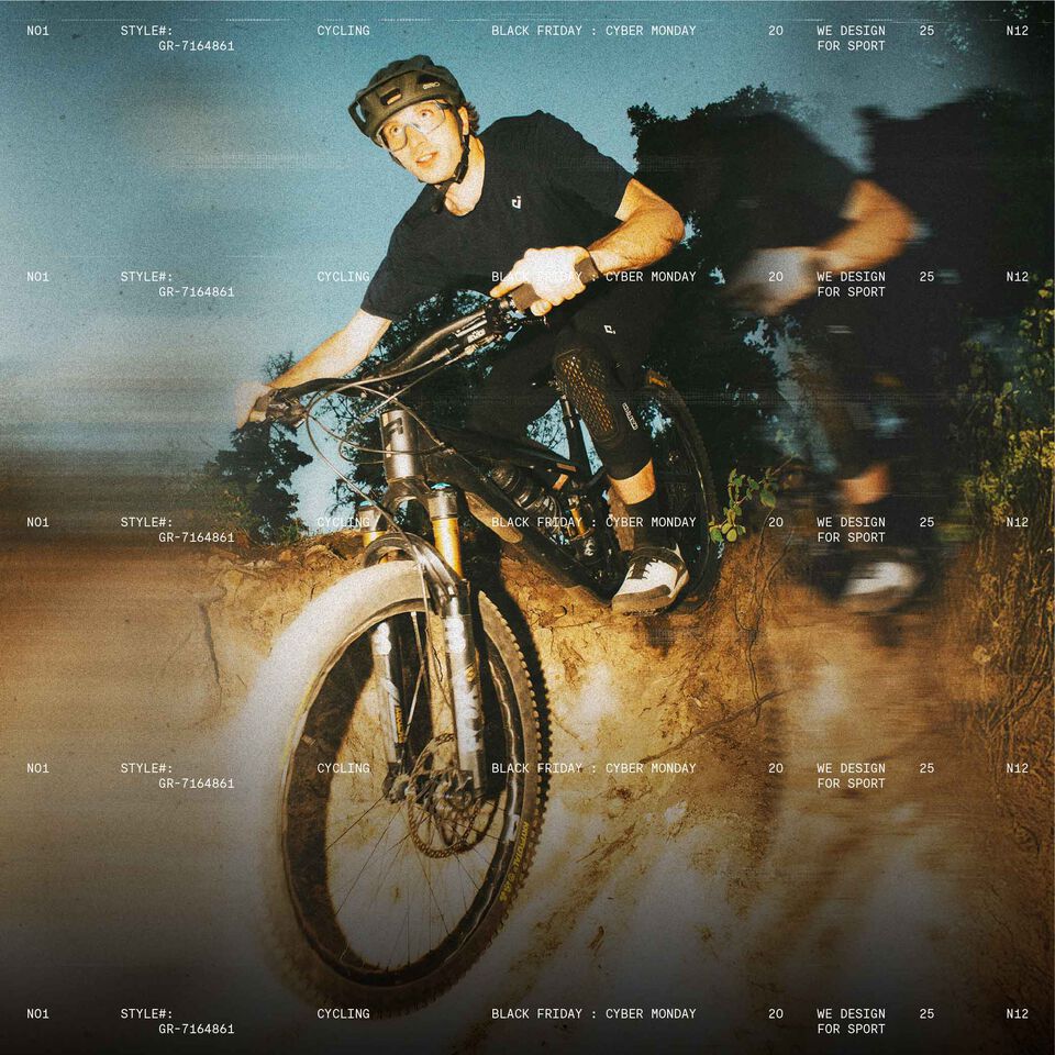 mtb rider going downhill with stylized text in the background