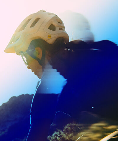 Giro cycling helmet in a blurry rider