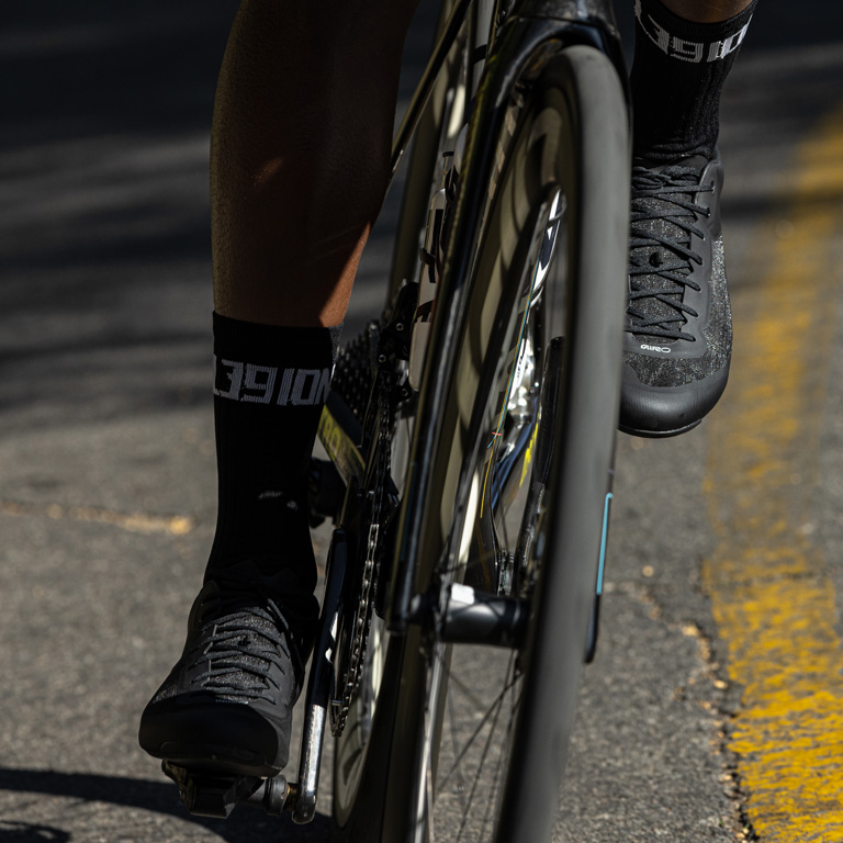 Action Shot of a bike rider wearing Giro road shoes