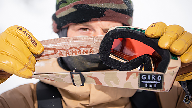Bryan Fox showing the inside of his custom goggle strap, showing a snake illustration and text 'Ramona'