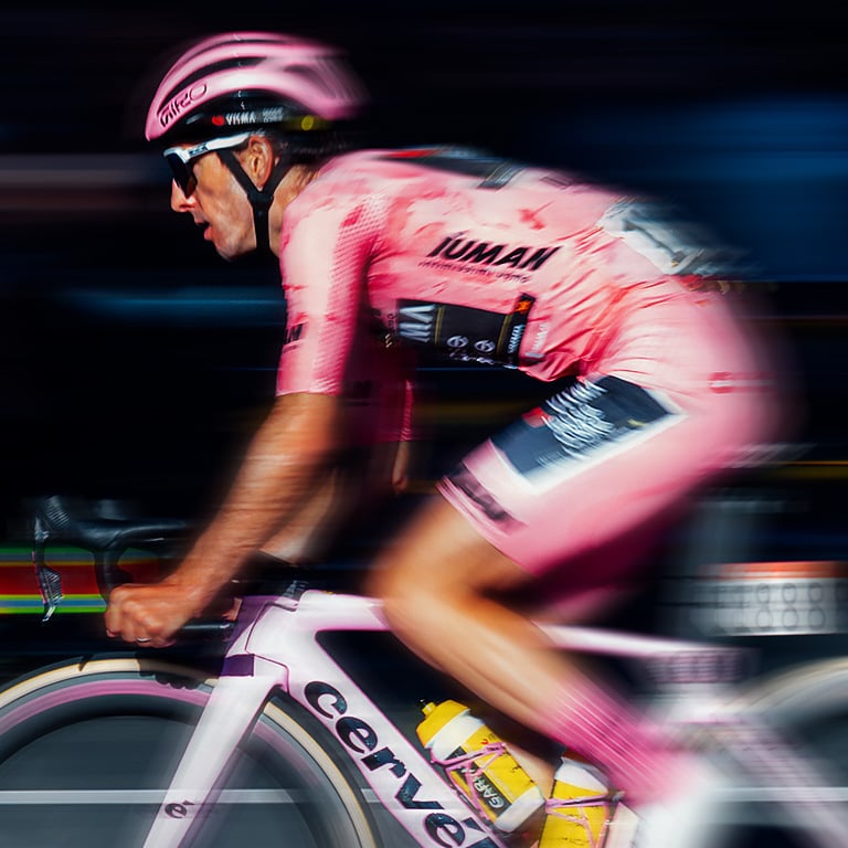 Giro rider on a gravel road and bike with Aries helmet