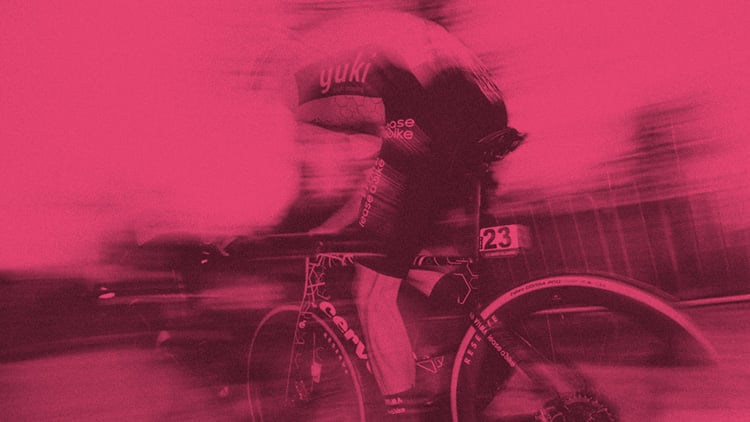 Giro athlete racing with a pink blurry background