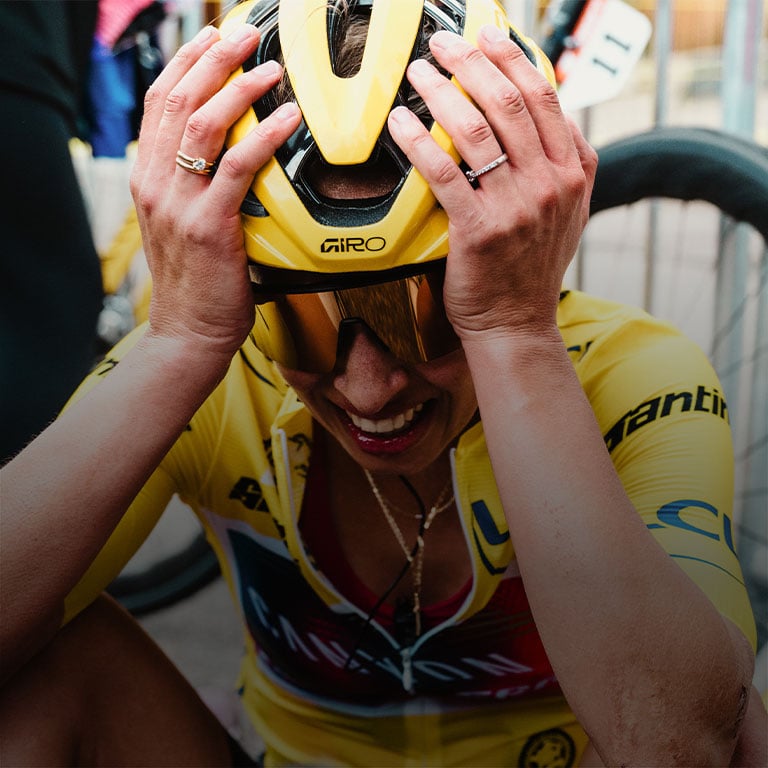 Giro racer celebrating with Giro helmet