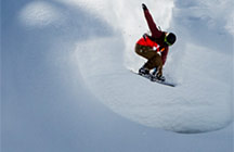 Snow boarding down slope
